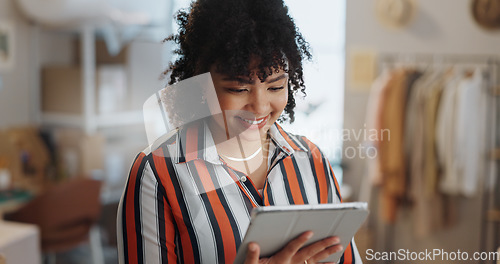 Image of Businesswoman, happy and smile with tablet in office for customer review, feedback or success of delivery. African person, fashion designer and excited for growth in sales, retail and e commerce