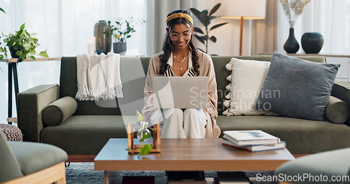 Image of Laptop, freelance and happy woman on sofa for social media, research or reading at home. Tech, remote work or female entrepreneur online in living room with email, learning or upskill training course