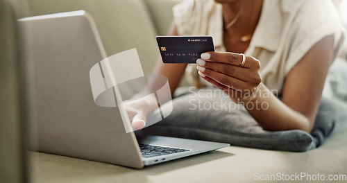 Image of Credit Card, laptop and hands of woman online shopping for discount deal, financial purchase or ecommerce choice. Debit, easy payment and closeup customer typing banking password on home lounge couch