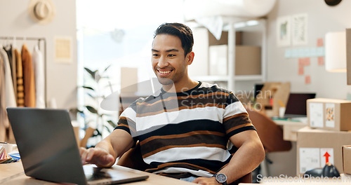 Image of Designer man, laptop and boxes with smile, scroll and e commerce with stock, clothes and check sales report. Entrepreneur, small business owner and computer with fashion, inventory and distribution