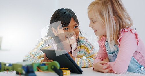 Image of Children, learning and tablet in robotics classroom for engineering, science and technology education. School, teamwork and girls online together with elearning game, problem solving or research