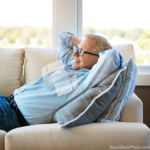 Image of Thinking, sofa or happy mature man in house living room to relax with nostalgia or freedom on resting break. Glasses, remember or senior male person with smile, joy or memory in retirement on couch