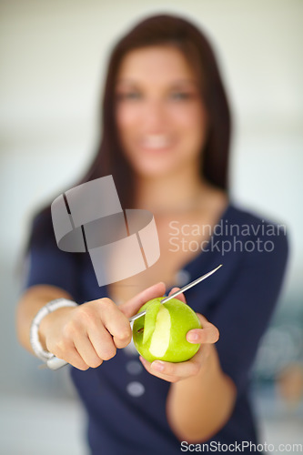 Image of Hands, knife and woman peeling apple for food, eating organic vegan snack and vitamin c. Closeup, cutting skin on fruit and person slice for healthy diet, natural benefits and wellness or nutrition