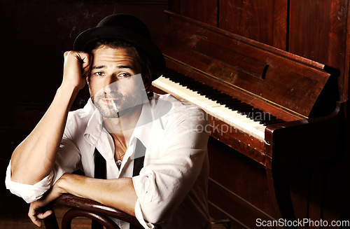 Image of Portrait, man and musician with a cigarette, piano and entertainment with talent, style and performer. Face, pianist and artist with tobacco, smoking and jazz player with unhealthy habit or creative