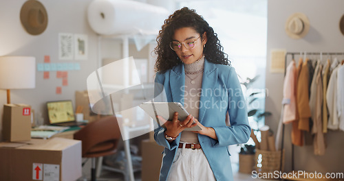 Image of Woman, fashion designer and tablet in logistics, research or small business management at boutique. Female person or entrepreneur working on technology for inventory or storage check at retail store