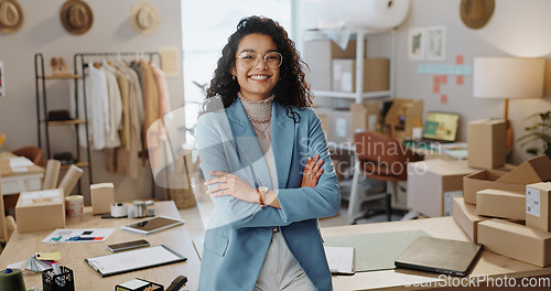 Image of Portrait, business woman and fashion designer with arms crossed in boutique, clothes store or startup. Confidence, happy tailor and professional, entrepreneur and creative worker in glasses in Brazil