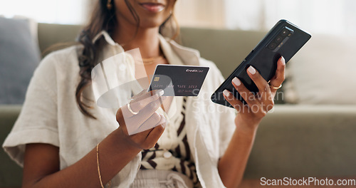 Image of Woman, hands and phone with credit card for online shopping, payment or transaction in living room at home. Closeup of female person or shopper on mobile smartphone with debit for ecommerce at house