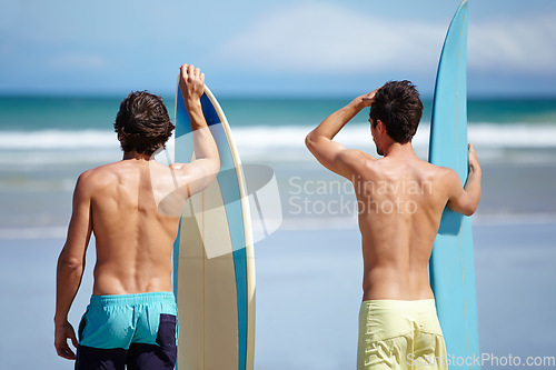 Image of Beach friends, surfboard and sports people on holiday adventure, travel vacation or ready for hobby, activity or surfing. Nature, ocean sea waves or back of surfer, athlete or partner looking at view