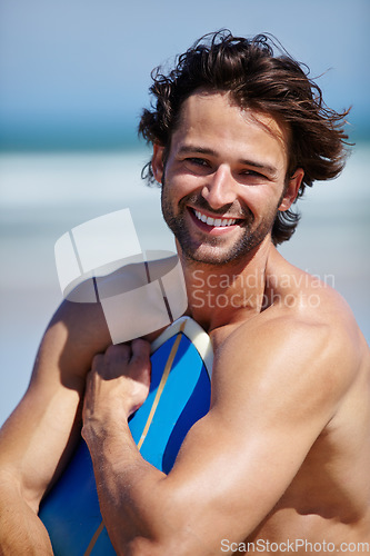 Image of Beach surfboard, sports portrait and man smile for ocean freedom, sea waves or Portugal surf training vacation. Happiness, sunshine or outdoor surfer happy fresh air, wellness or surfing performance