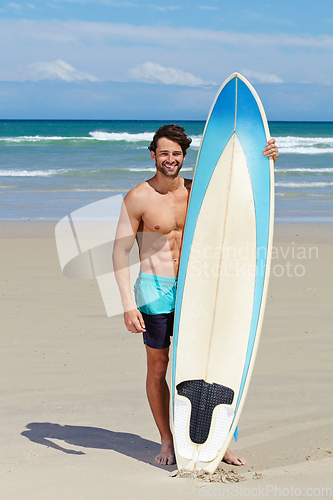 Image of Beach portrait, surfboard and sports man on holiday, vacation or Spain getaway for nature, freedom or natural outdoor wellness. Surfboard, summer and face of relax surfer on tropical island sand