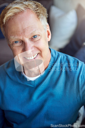 Image of Portrait, mature or happy man in home with confidence or joy on living room sofa in an apartment. Relax, face or senior person with smile, peace or wellness in home for a resting break in retirement