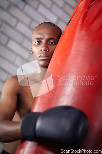 Image of Sports portrait, punching bag or black man, boxer or fighter training for muay thai contest, kickboxing competition or challenge. Gym, exercise and athlete ready for workout, fitness or boxing fight