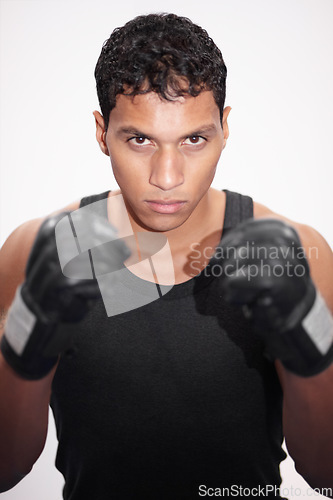 Image of Portrait, fight and a man or boxer on a white background for a competition, fitness or training for a match. Exercise, cardio and a strong male fighter with gloves for a sport, boxing or workout