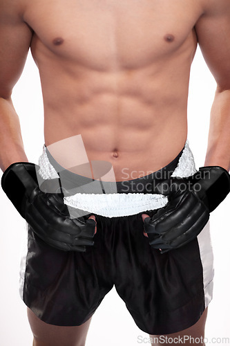 Image of Sports, strong body and mma man, boxer or fighter ready for contest, competition or fighting workout challenge. Abs muscle, torso and studio athlete training, exercise or boxing on white background