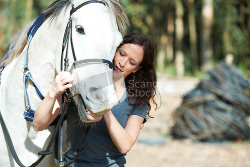 Image of Woman with horse in countryside, animal and equestrian with riding outdoor and ranch. Sports, recreation and farm with young rider in nature, stable and jockey with mare or pet, training for rodeo