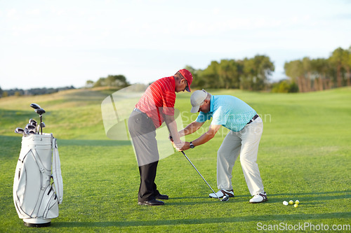 Image of Golf training, help and men with a game on a field for a competition, showing or support. Fitness, exercise and friends or people on a course for sports advice, assistance and at a professional club