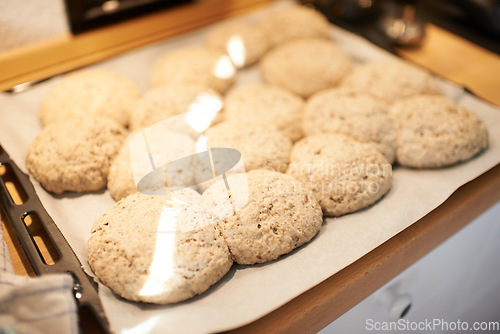 Image of Closeup, tray and bread in an oven from a bakery for diet, nutrition and eating pastry food. Zoom, health and carbs, pita or loaves of rolls on a shelf for baking, cooking or lunch at a restaurant