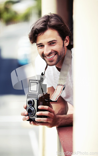 Image of Portrait, man and photographer with a camera, city and smile with vacation, travel and tourism. Face, person and guy with equipment, summer holiday and Italy with photograph, capture moment and relax