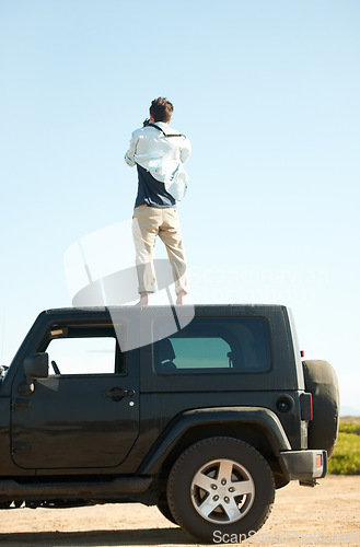 Image of Man, photographer and camera on roof of car, summer road trip or vacation outdoor on mockup space. Back view, person on suv rooftop and photography of driver on transport, nature adventure or travel
