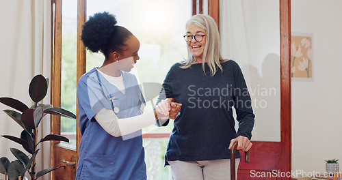 Image of Senior woman, nurse and help with walking stick for rehabilitation, wellness and talk with smile. African caregiver, happy patient and elderly person with disability, cane and support for recovery