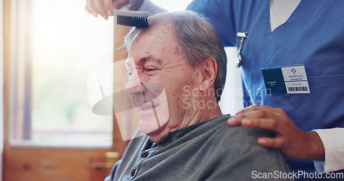 Image of Senior man, nurse and comb hair with smile for grooming, care and wellness with helping hand in retirement. Elderly person, caregiver and haircare in nursing home for support, assisted living or talk