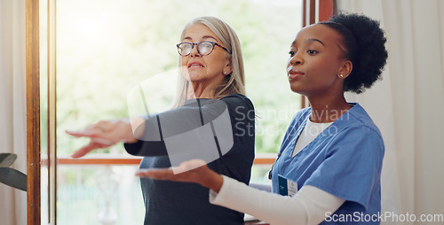 Image of Physical therapy, senior woman and stretching at a retirement home for wellness and healthy. Medical, worker and caregiver with elderly consultation at clinic with help and support of chiropractor