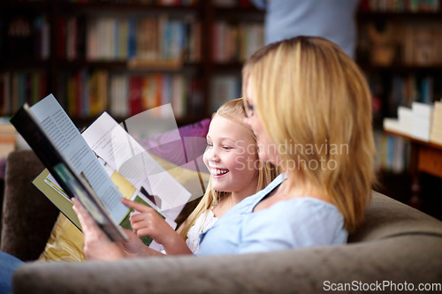 Image of Reading, books and mom with child in library with smile, learning and relax, studying and knowledge. Storytelling, happy mother and girl on bookstore sofa together with story, fantasy and education.