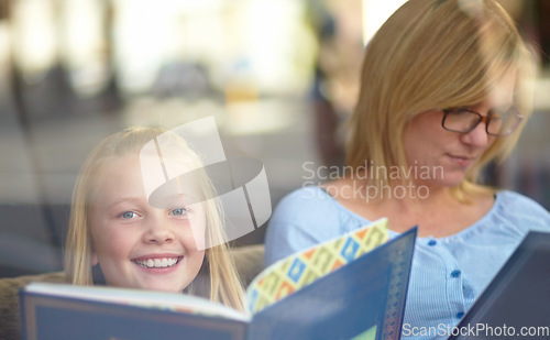 Image of Reading, portrait and mother with child in bookshop with smile, learning and relax in knowledge. Storytelling, happy mom and girl in library together with story, fantasy books and education in window