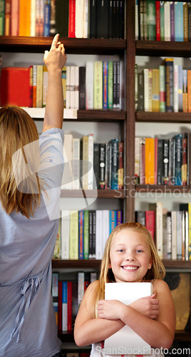 Image of Portrait, books and child in library with excited smile, learning and relax with study knowledge. Storytelling, happy mom and girl in bookstore together with story, fantasy and education in reading.
