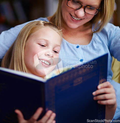 Image of Reading, books and mother with girl in library with smile, help learning and relax with study knowledge. Storytelling, happy mom and child in bookstore together with story, fantasy and education.