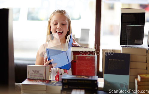 Image of Smile, stack of books and child in bookshop, learning and relax, studying homework knowledge in store. School, happiness and girl reading in bookstore with story, fantasy and education in shop window