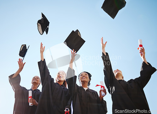 Image of Graduation, students and education goal success celebration with happy women excited victory hat throw. University, motivation and friends graduate together, united achievement for young learners