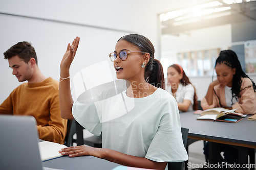 Image of Education through questions by students at university with diversity during lecture. Young woman in classroom, asking with hand up while classmate listen on. Motivation through discussion.