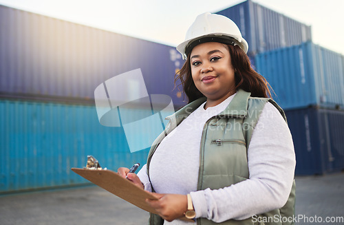 Image of Logistics, supply chain and shipping with a delivery woman working on a dock with documents on a clipboard and a container yard in the background. Stock, cargo and freight with a female export worker