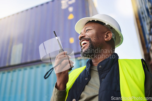 Image of Logistics, supply chain and radio with a man delivery worker talking on a walkie talkie while working in a container yard. Ecommerce, stock and cargo in the retail, shipping and export industry