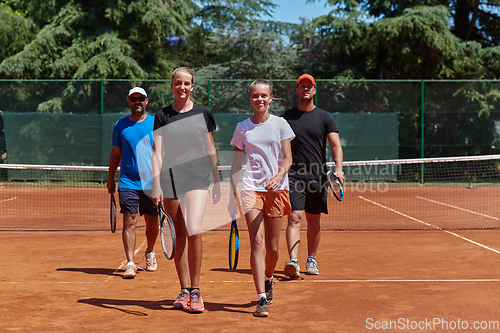 Image of Tennis club together after hard training, showing their dedication, hard work, and teamwork.