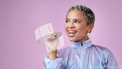 Image of Thinking, idea and happy black woman in studio with mockup space with a solution. Happiness, smile and young african model with a positive thought, insight or question with purple background.