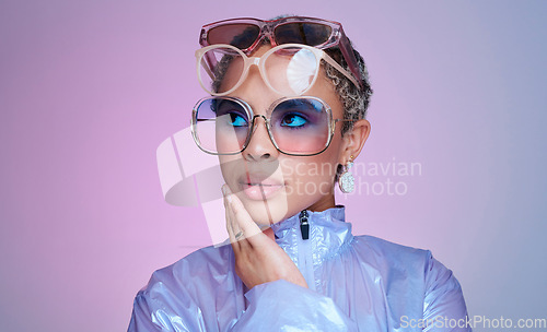 Image of Fashion, black and woman or influencer with sunglasses trendy, cool and fun with stylish or casual look. Young, girl or lady in bold makeup and relax in pink studio background empowered or confident.