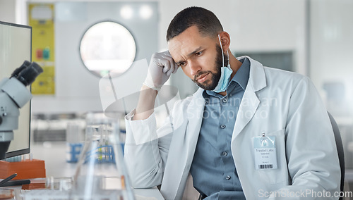 Image of Science, research and covid with a confused man engineer working on innovation in his laboratory. Thinking, analytics and development with a male scientist at work in his medical lab on breakthrough