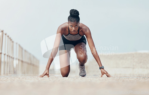 Image of Fitness, runner and woman start running workout along beach, cardio and speed training. Sports, exercise and portrait of black woman prepare for marathon with morning run, serious, focus and intense