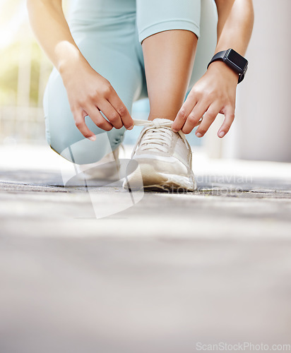 Image of Shoes, foot and woman running in the road for cardio training, fitness and body wellness in the city of Amsterdam. Athlete runner ready for exercise, workout and sports marathon in the street