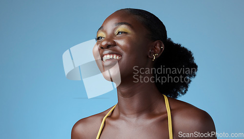 Image of Smile, yellow makeup and fashion black woman happy and relax with a studio background with cosmetics. African American girl, lady or young female shows empowerment, proud and black girl magic.