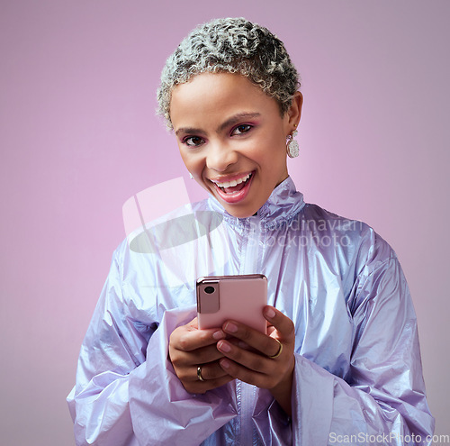 Image of Happy black woman, smile and phone for communication advertising, texting and social media on a studio background. Portrait of a isolated African American female chatting on 5G mobile smartphone