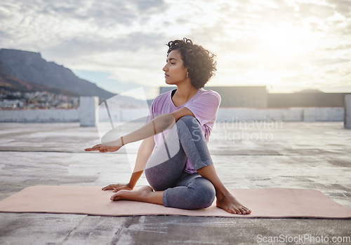 Image of Stretching, yoga and wellness woman exercise outdoor town and city. Exercise, fitness and calm person meditation on ground for workout, pilates or training for healthy body, spiritual and awareness