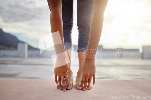Image of Stretching, feet and legs of woman in yoga meditation or outdoor exercise with morning sunshine lens flare. Sports, pilates or cardio person with workout training for zen, calm and healthy lifestyle