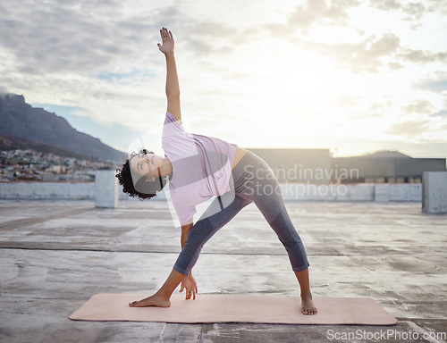 Image of Woman in city doing yoga, exercise and workout in the morning. Young Indian woman doing fitness, stretching and training in outdoor urban area or town. Wellness, zen and motivation for a healthy mind