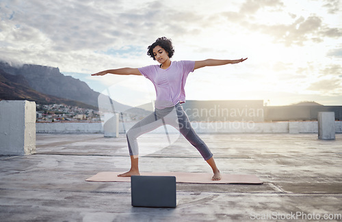Image of Yoga, laptop workout and woman outdoor training with stretching exercise on internet in Cape Town. Girl with pilates for wellness, energy and fitness health with video on streaming tutorial in a city