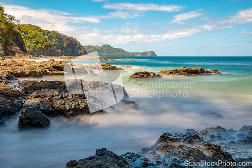 Image of Long exposure, pacific ocean waves on rock in Playa Ocotal, El Coco Costa Rica