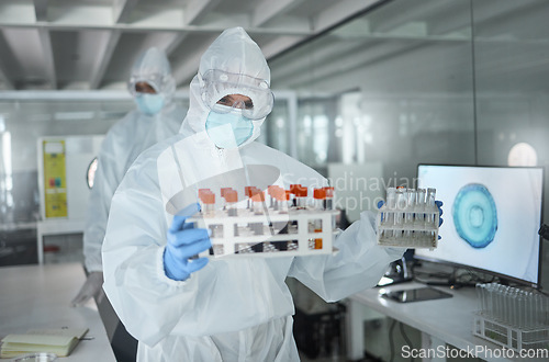 Image of Lab, science and research on virus, dna or blood in vial for analysis to find medical solution. Scientist, ppe and laboratory with samples to work on innovation in healthcare, medicine or biology
