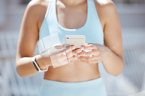 Image of Hands of exercise woman typing on a phone, check fitness app or step tracker for exercise support on training run. Sports, marathon runner or workout girl with digital tech for help on cardio running